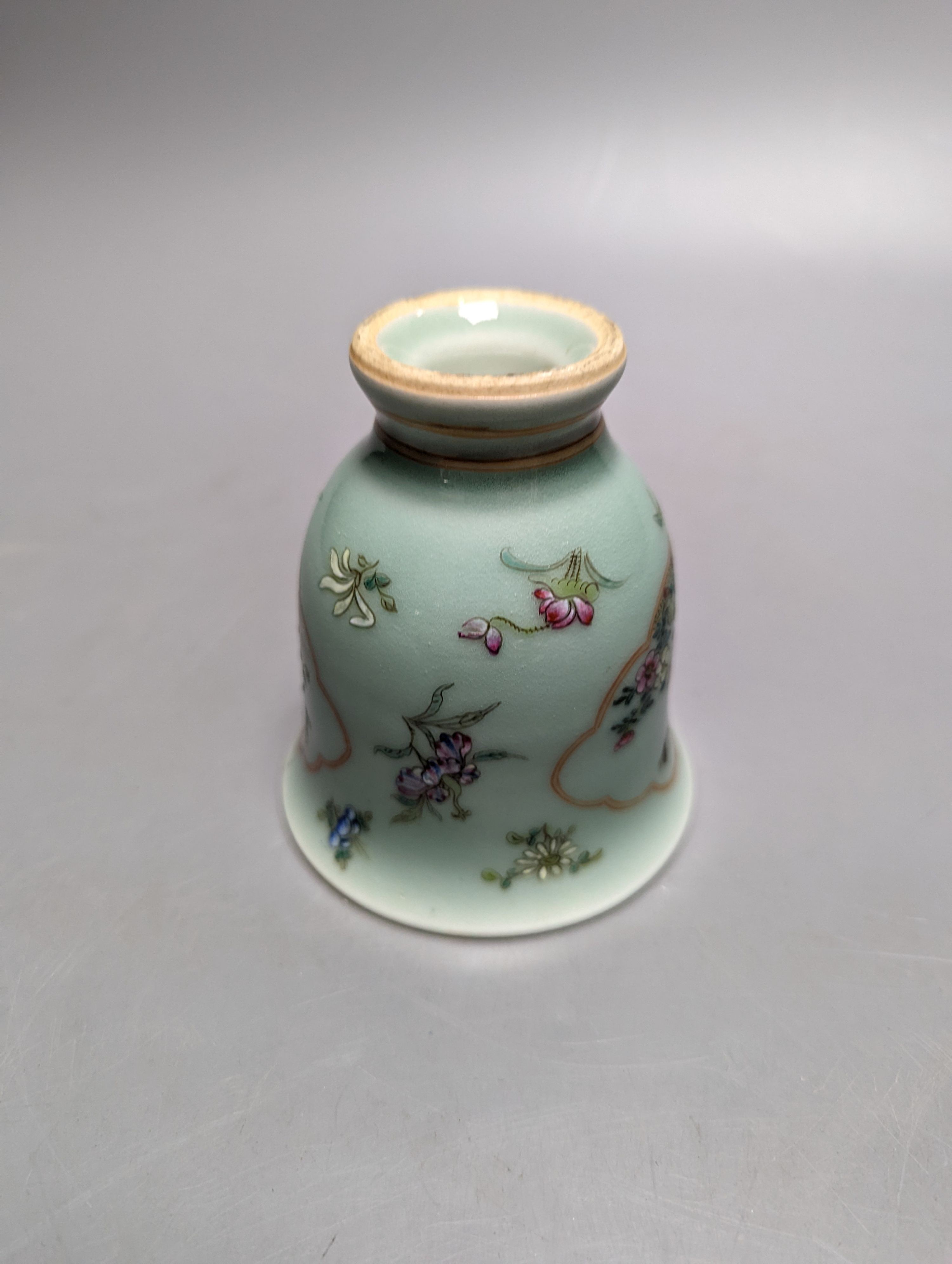 A Chinese celadon ground famille rose cup, Daoquang 10cm